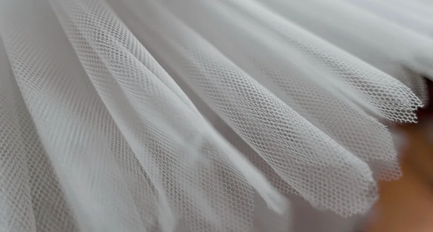 Lace and printed fabric swatch
